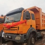 北奔重卡的北奔 V3 自卸车，拥有 380 马力的强大动力，具备高达 60 吨的载重能力，是工程运输的得力干将。